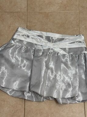 Bebe Shimmery Silver Mini Skirt with Crisscross Waistband